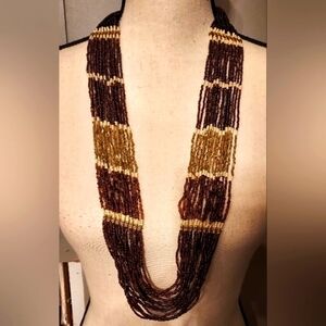 Boutique 18 strand multilayered seed bead brown and tan copper tone necklace.